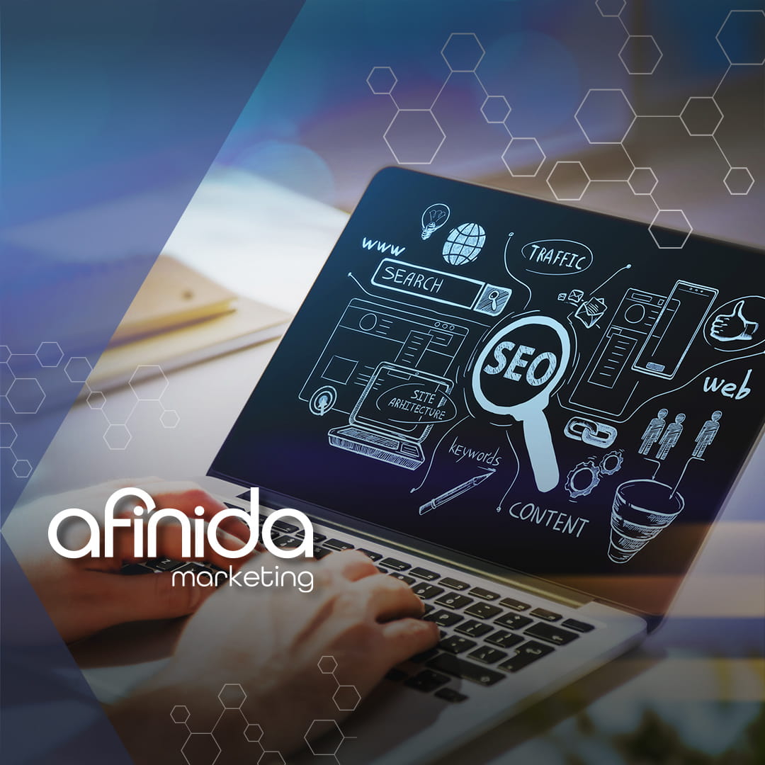 Laptop displaying SEO diagrams like search, keywords, and content planning, illustrating an effective SEO strategy for small businesses through website optimization and keyword-focused marketing.
