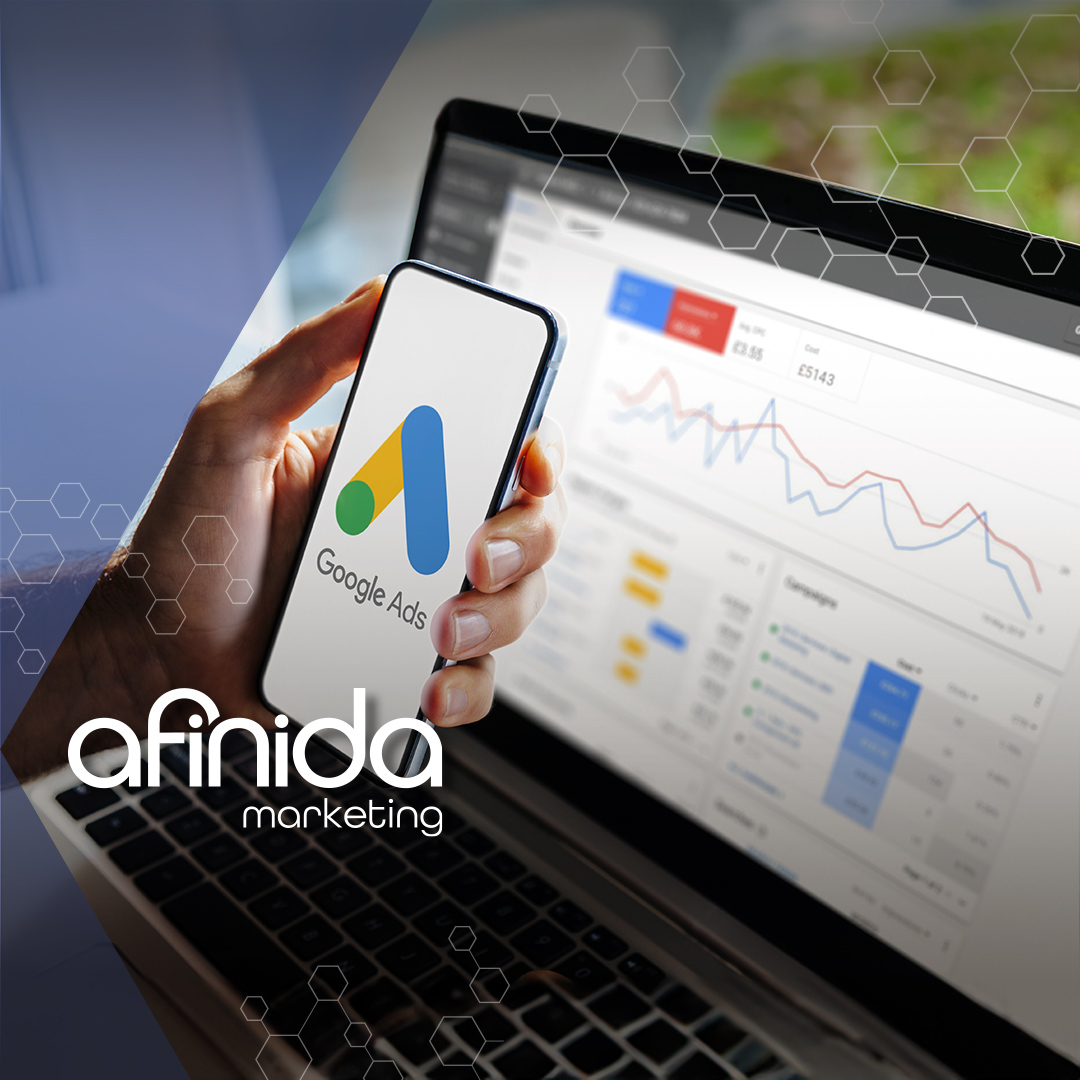 phone with google ads logo and computer dashboard on the background