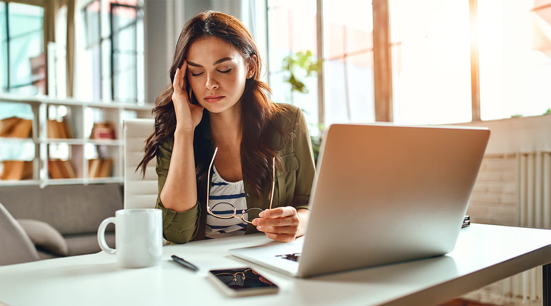 Business owner feeling frustrated while reviewing poor search rankings before hiring a San Diego SEO company.